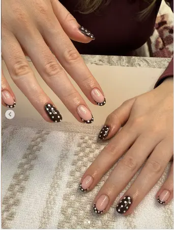 Navy nails with mini white polka dot tips